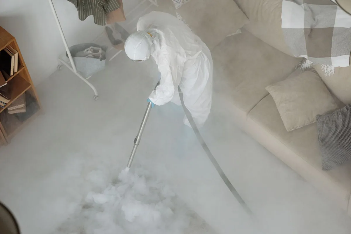 Biohazard cleanup technician in protective equipment, Marion, NY